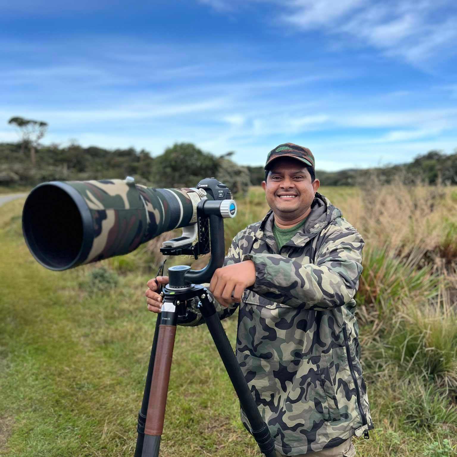 Indika Hettiarachchi, Sri Lanka wildlife photographer, with a telephoto lens in the field